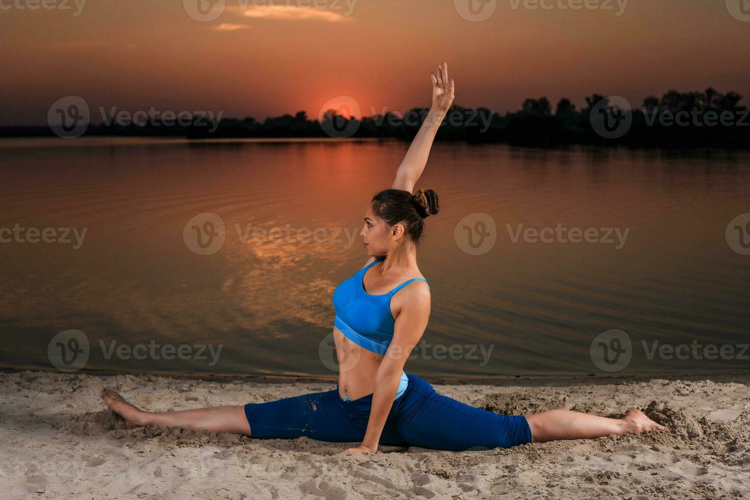 yoga at sunset on the beach. photo