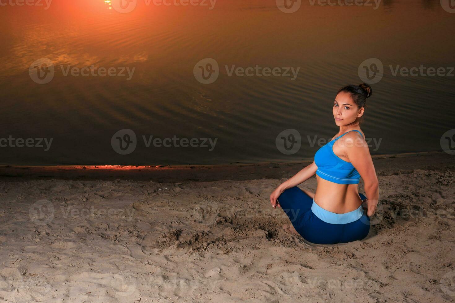 yoga at sunset on the beach. photo