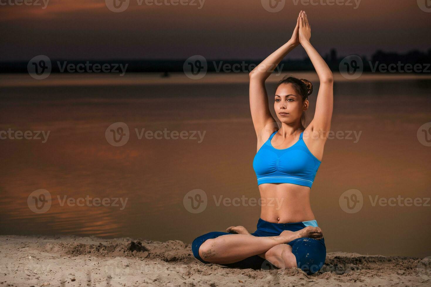 yoga at sunset on the beach. photo