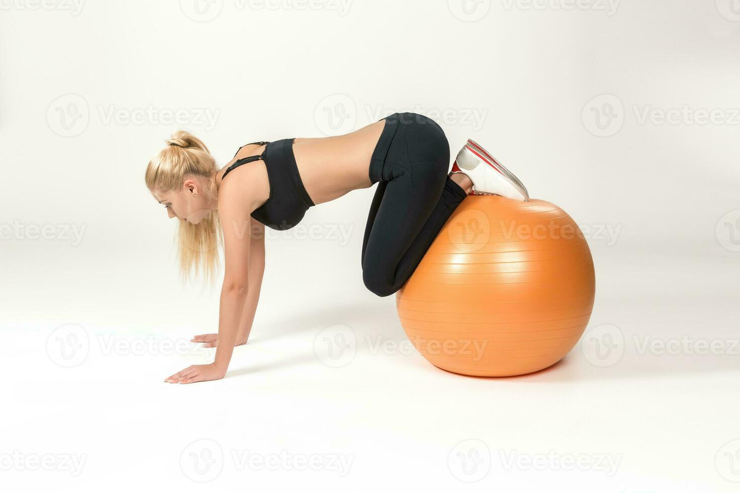 Young woman training with fitball photo