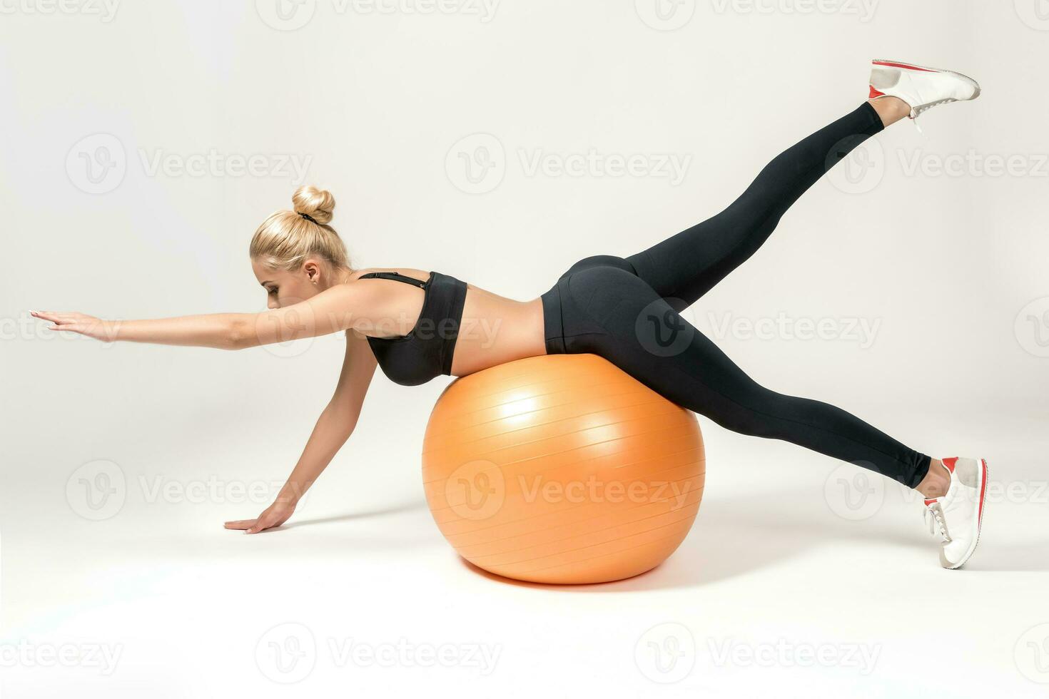 Young woman training with fitball photo