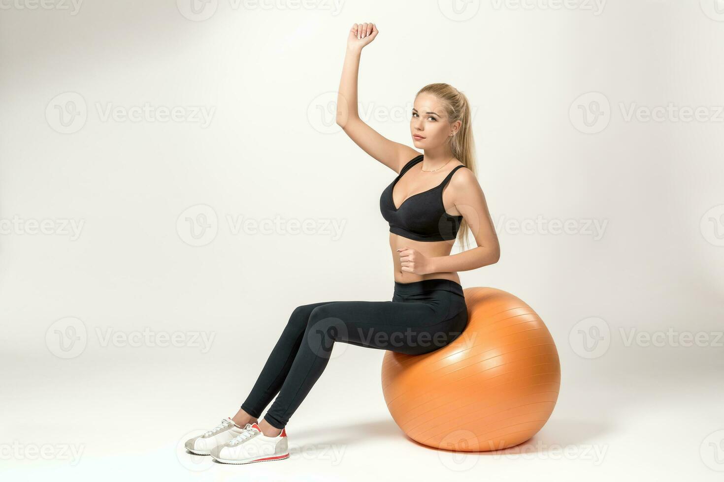 Young woman training with fitball photo