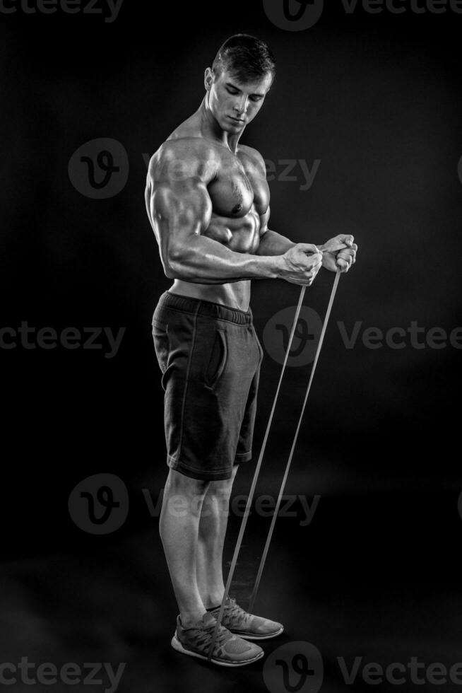 Young athletic man exercising photo