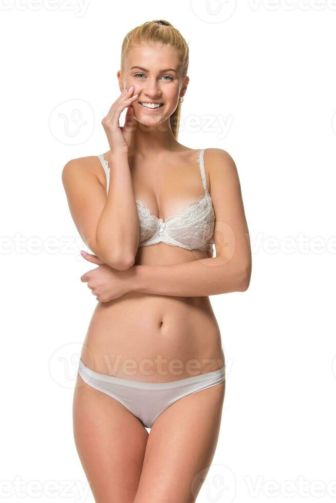 joven rubia mujer en blanco ropa interior, estudio foto