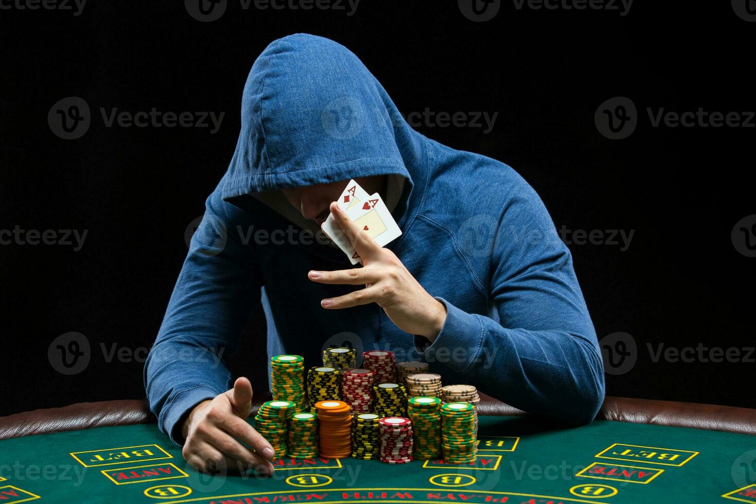 Poker player showing a pair of aces photo