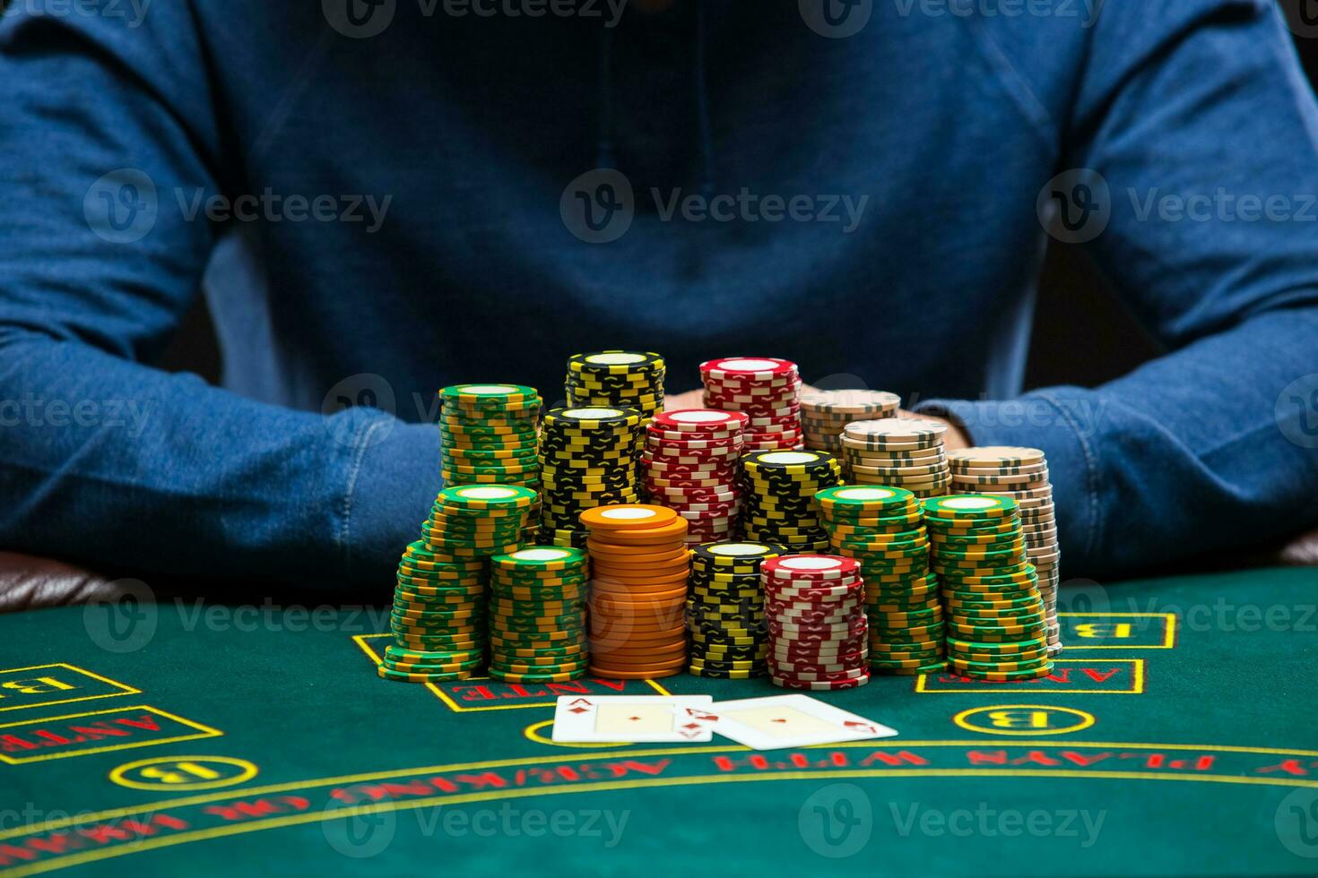 Poker player looking at combination of two aces. Closeup photo
