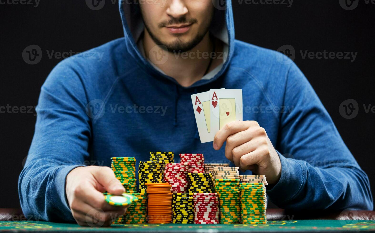 Poker player showing a pair of aces photo
