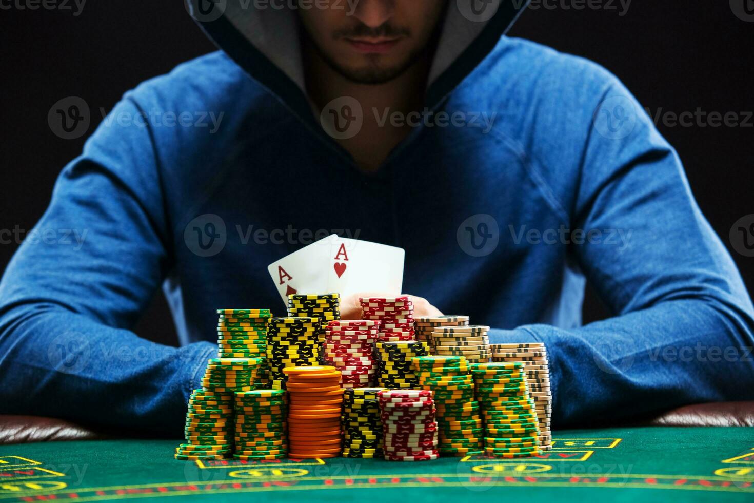 Poker player showing a pair of aces photo