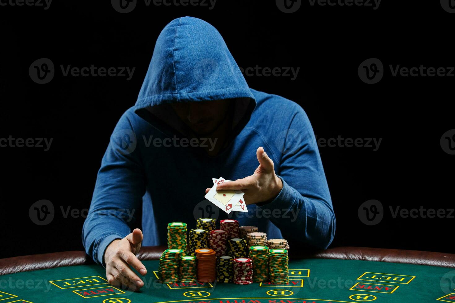 Poker player showing a pair of aces photo