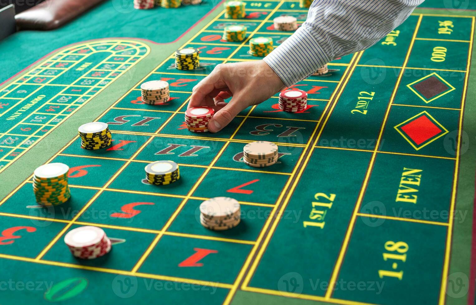 Picture of a green table and betting with chips. photo