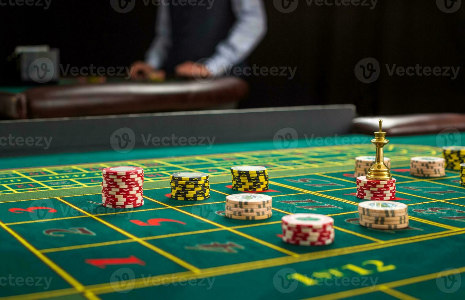 Picture of a green table and betting with chips. photo