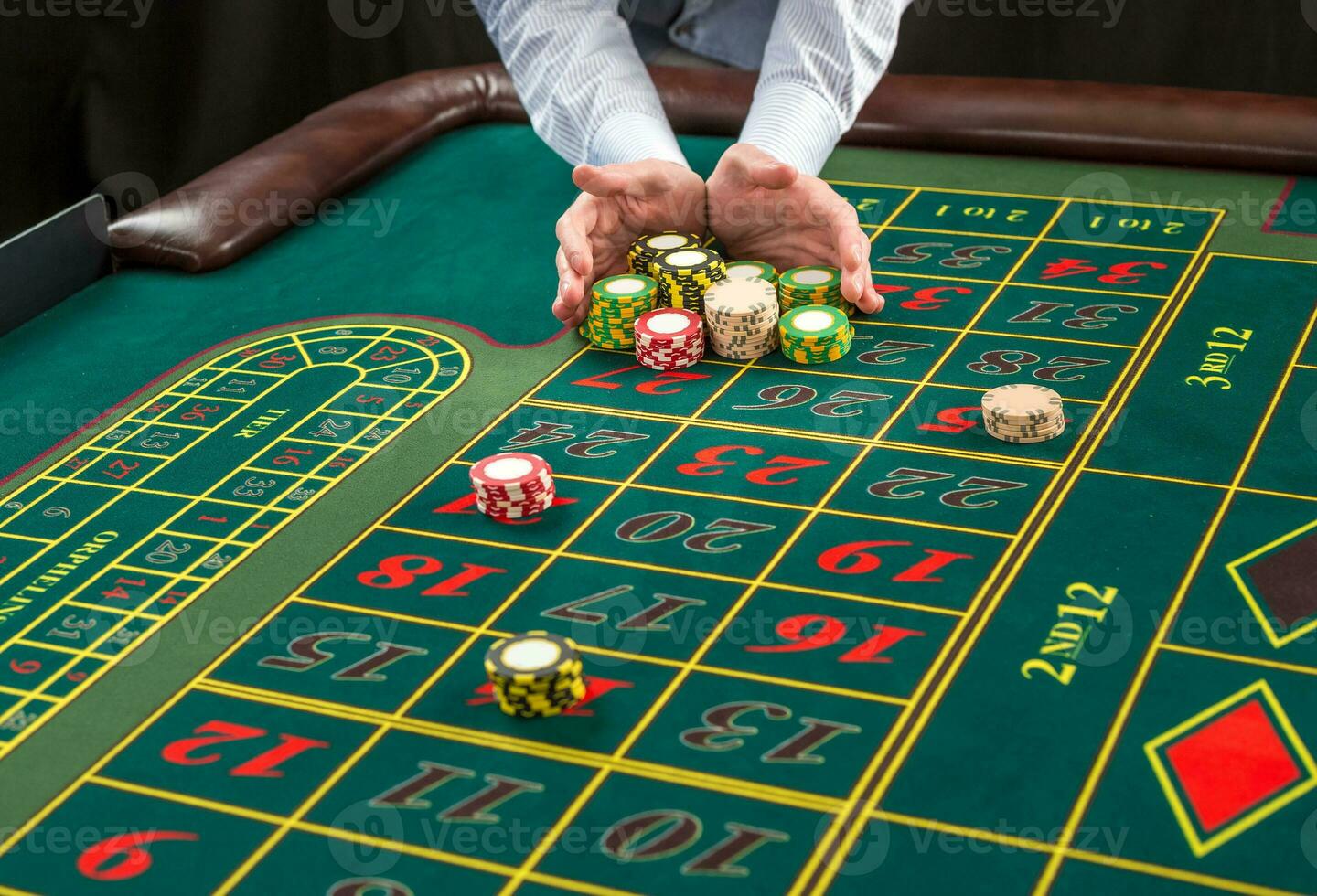 Picture of a green table and betting with chips. photo