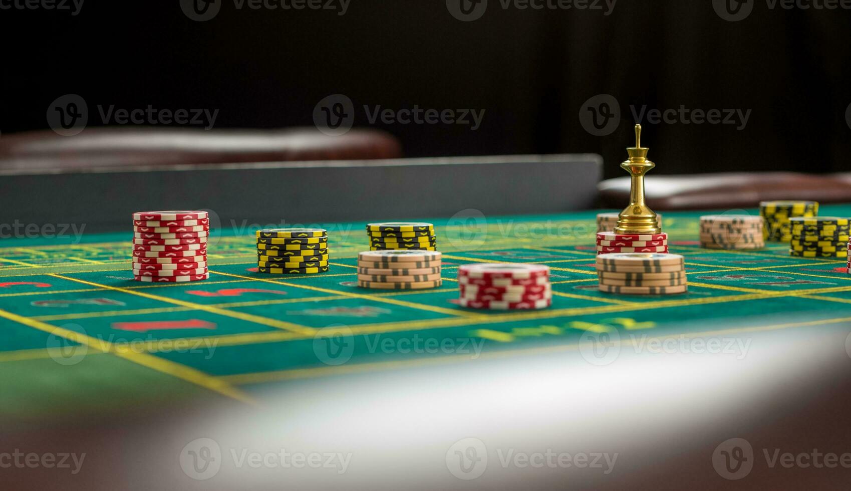 Picture of a green table and betting with chips. photo