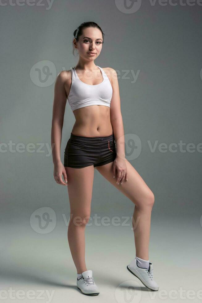 Sports young woman in shorts and top photo