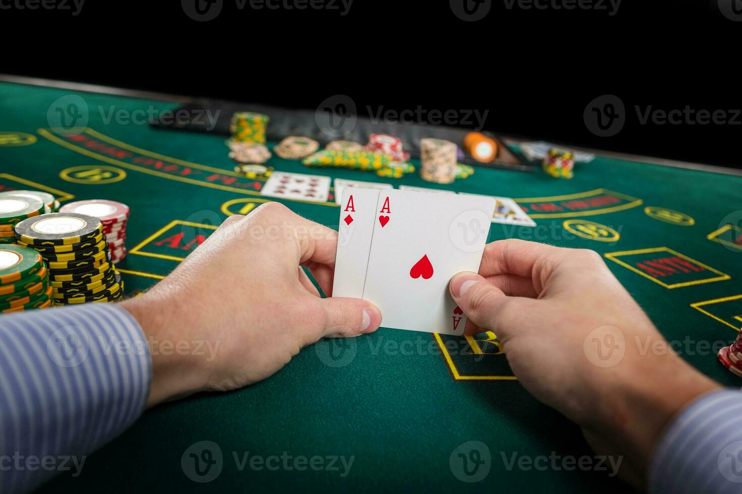 Male poker player holding the of two cards aces photo