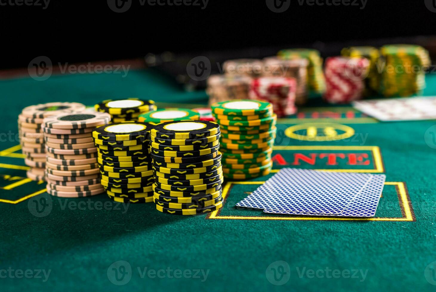 Poker chips on a poker table at the casino photo
