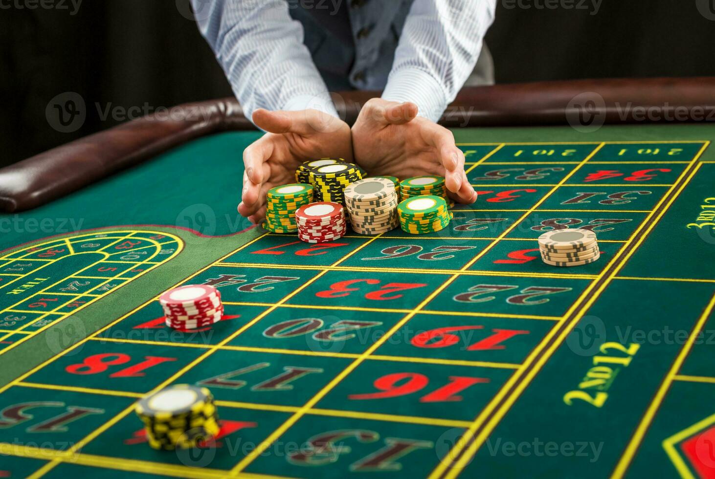 Picture of a green table and betting with chips. photo