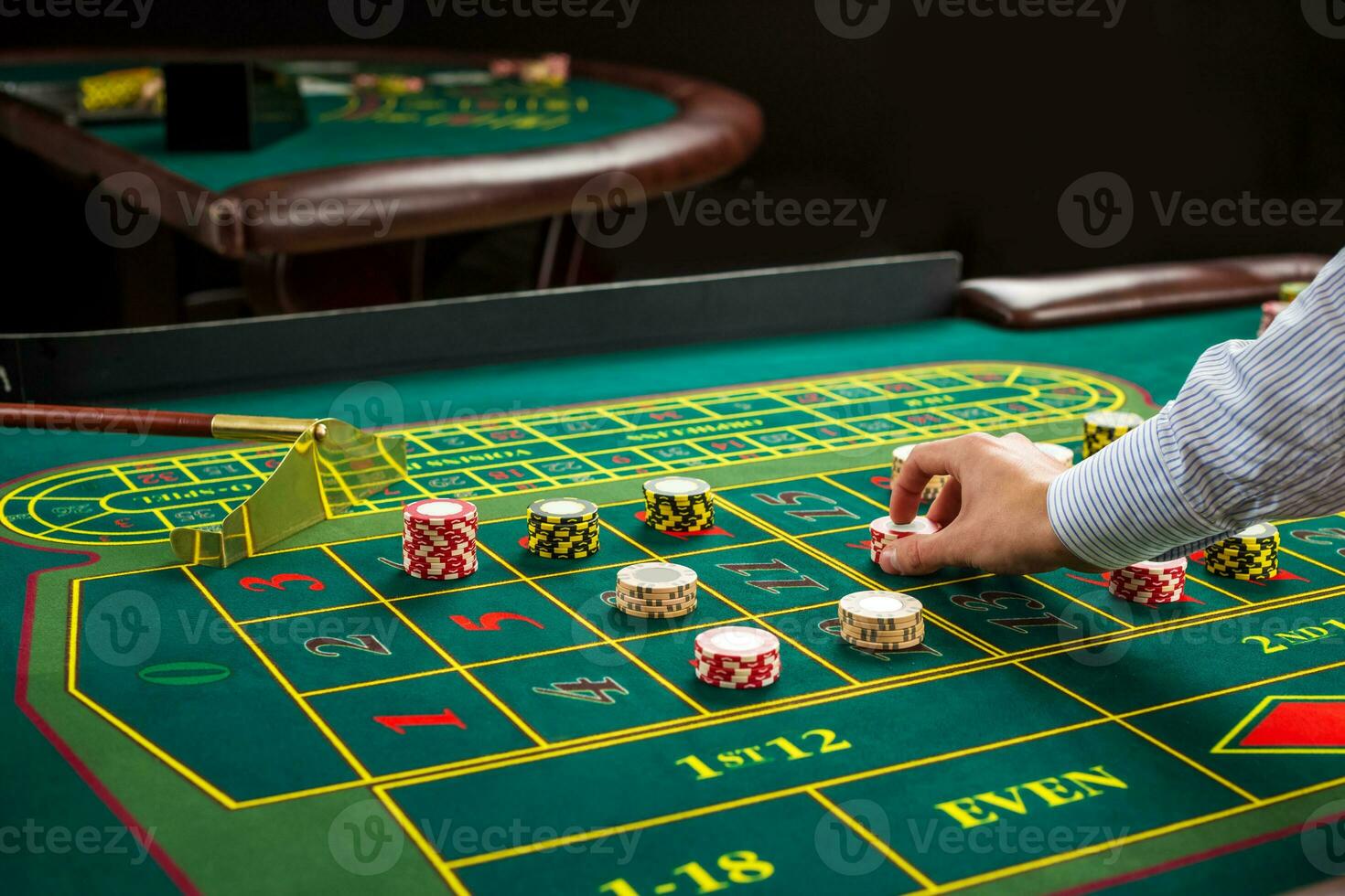 Picture of a green table and betting with chips. photo