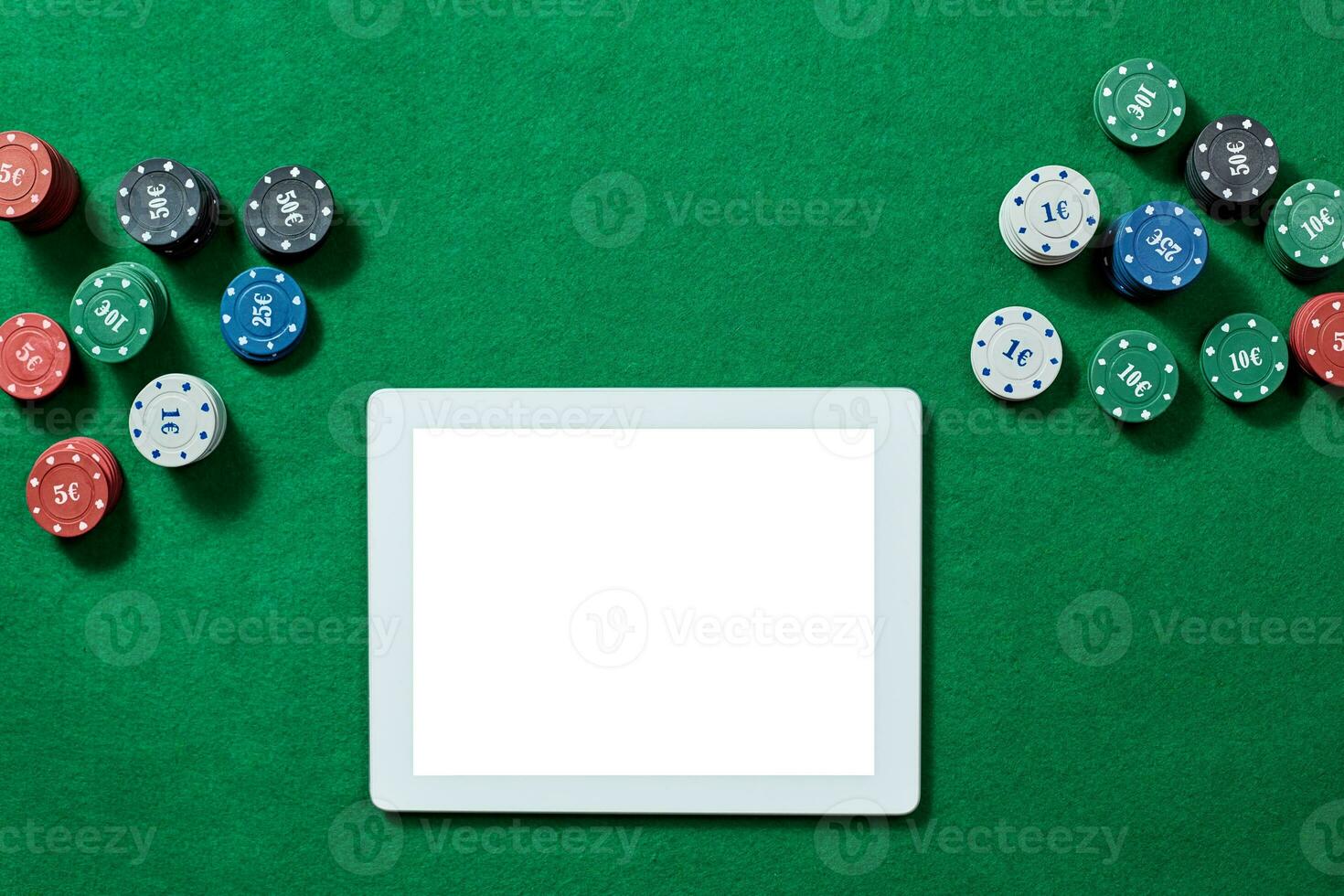 Online poker game with digital tablet and stacks of chips. photo