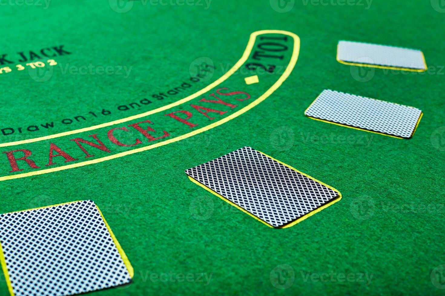 Playing cards on green table surface. Casino, gambling, poker concept photo