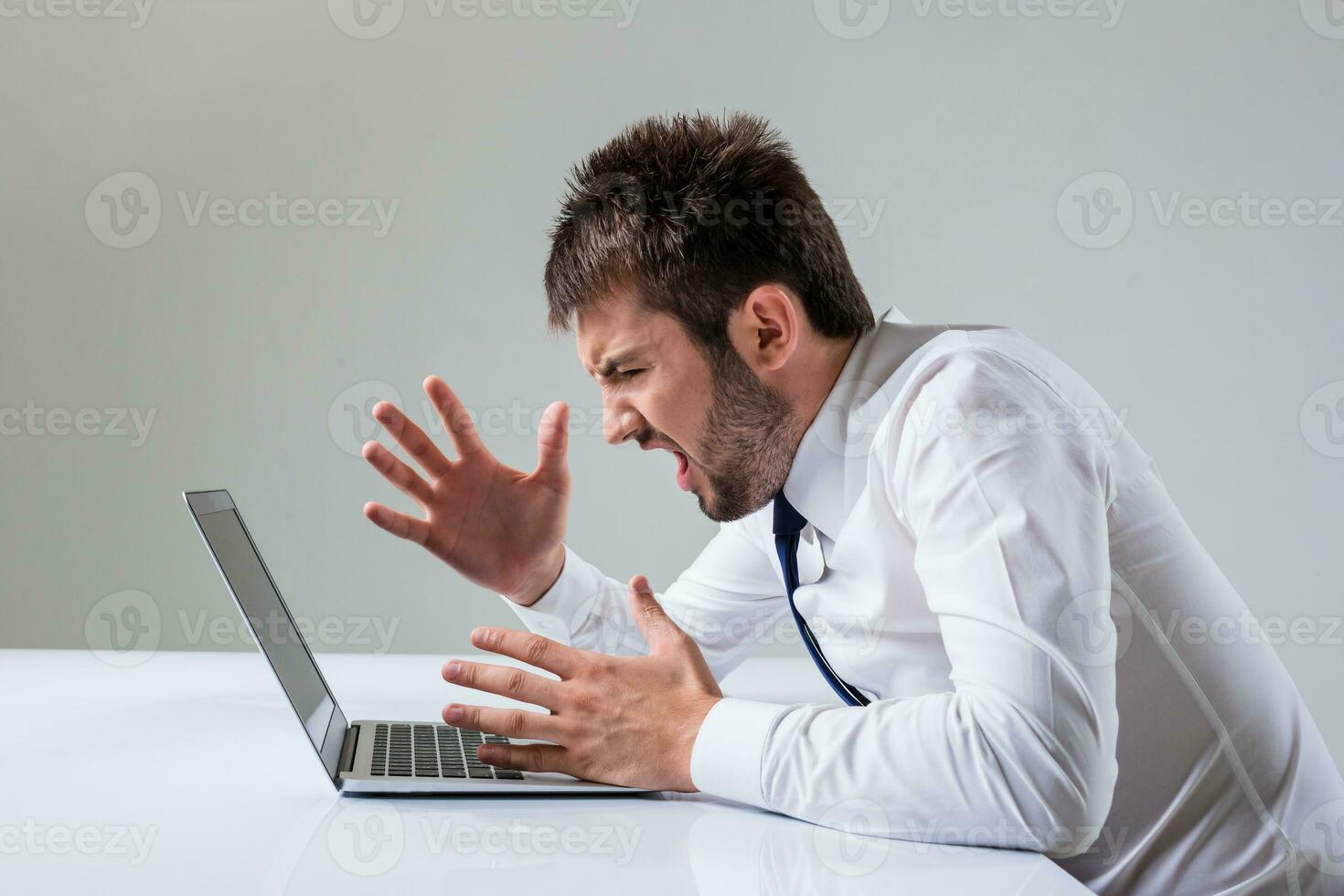 emotional man and laptop photo