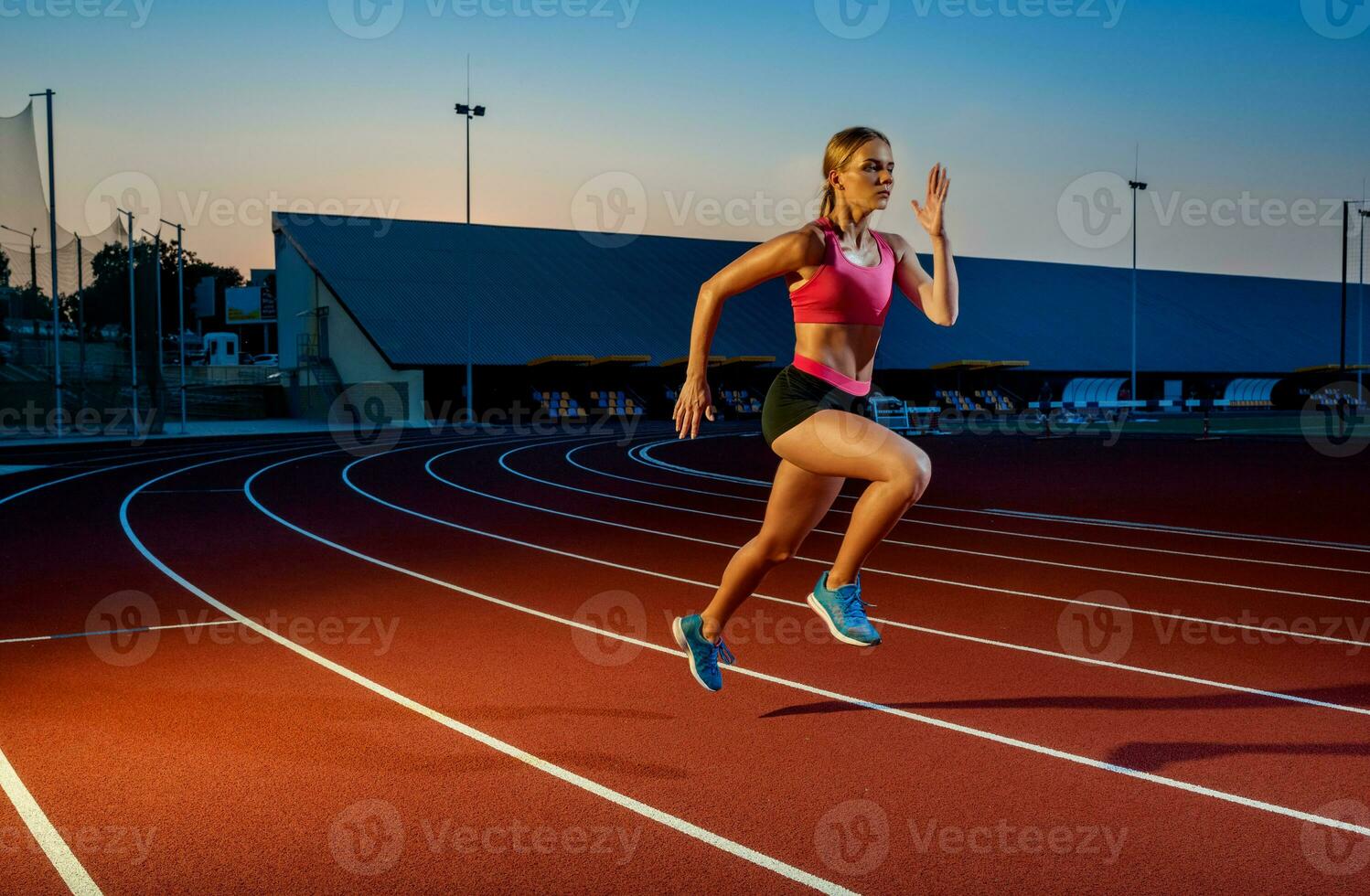 Runner sprinting towards success on run path running athletic track. Goal achievement concept. photo