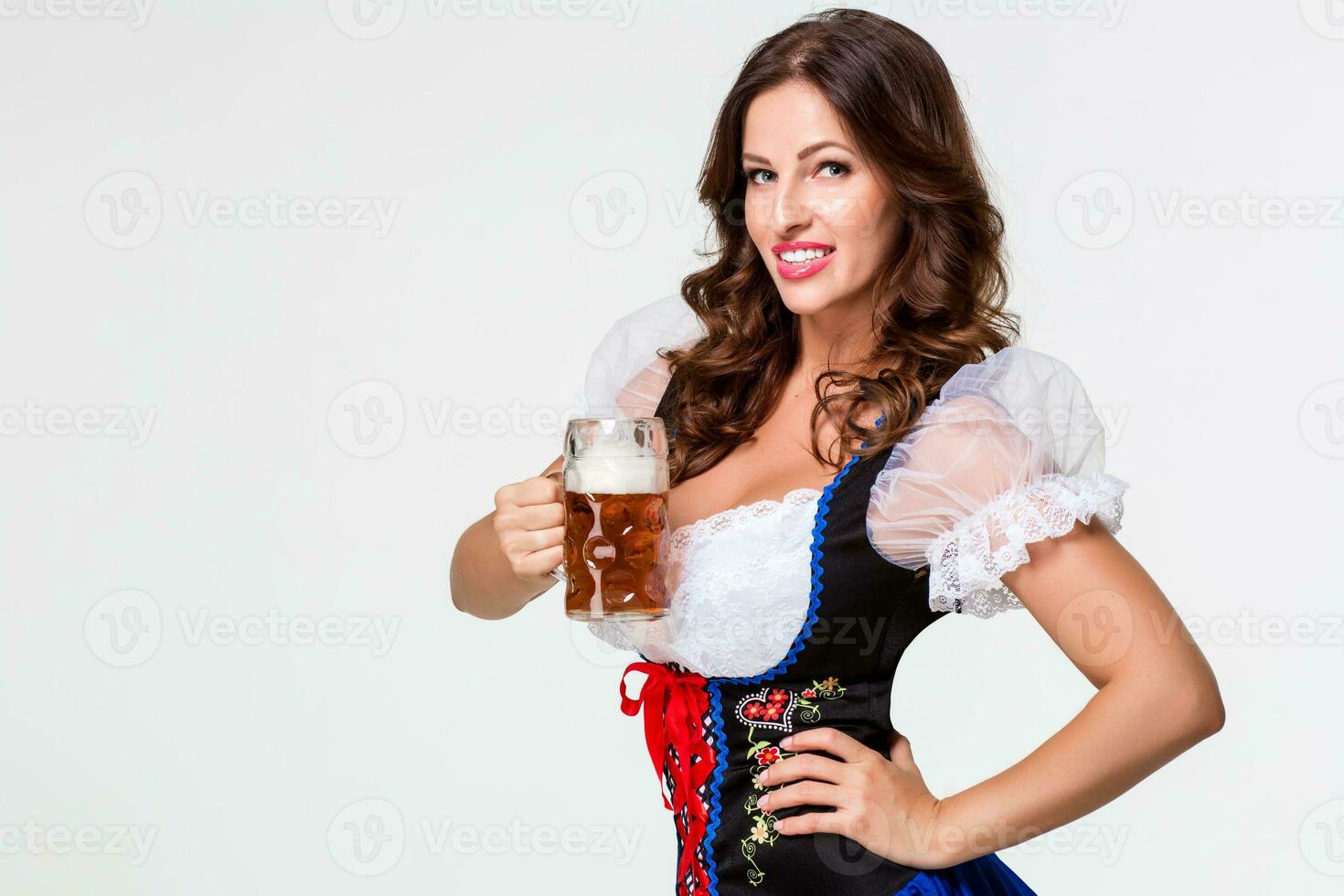 Beautiful young brunette girl of oktoberfest beer stein photo