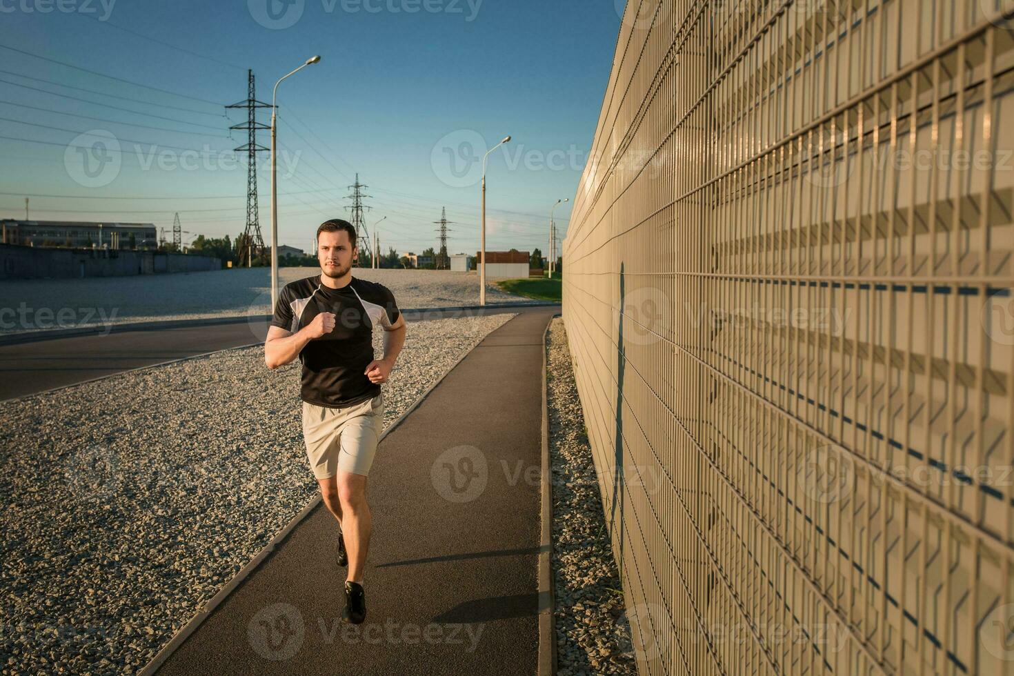 Full length portrait of athletic man running photo