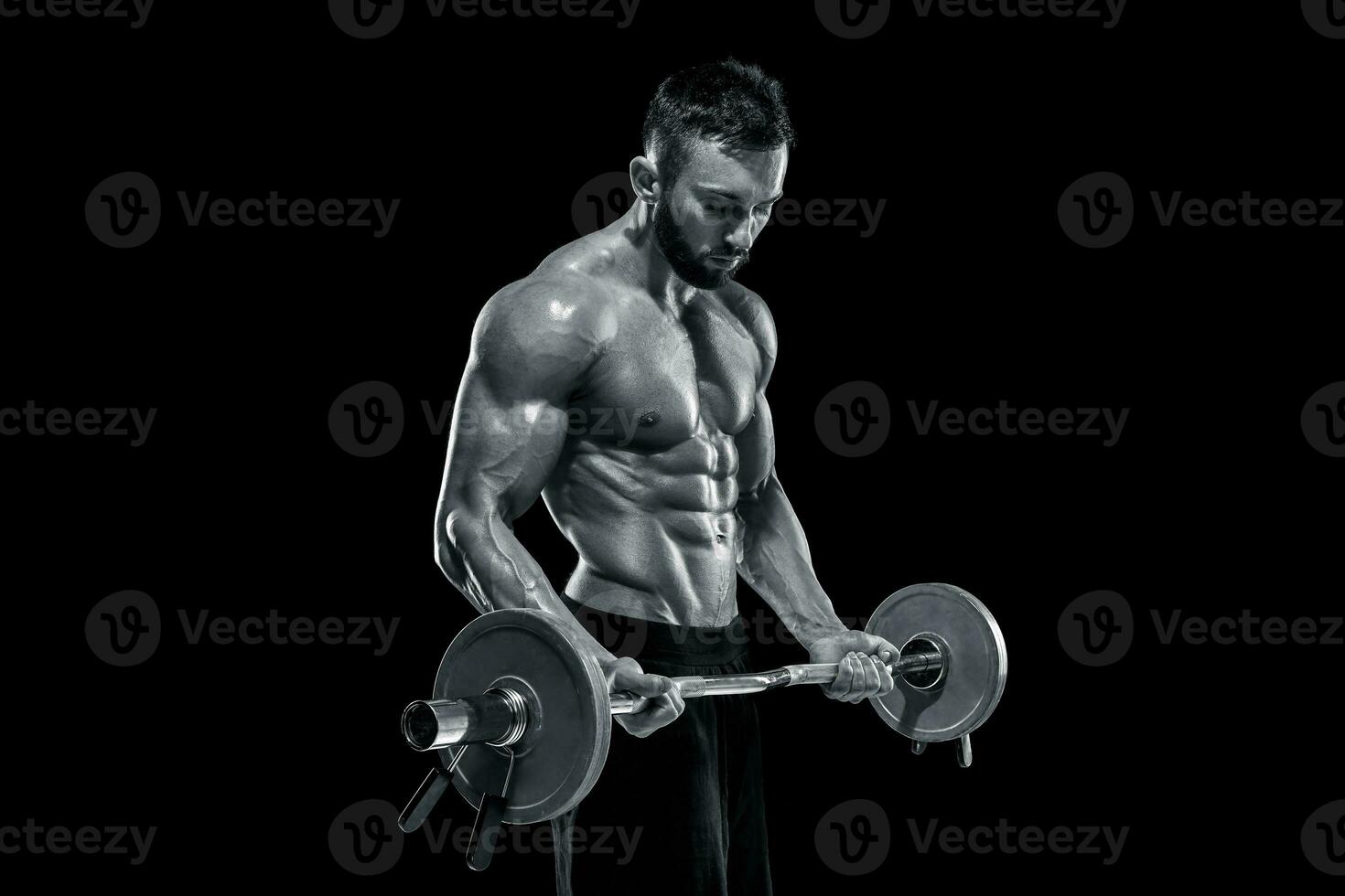muscular man lifting weights over dark background photo