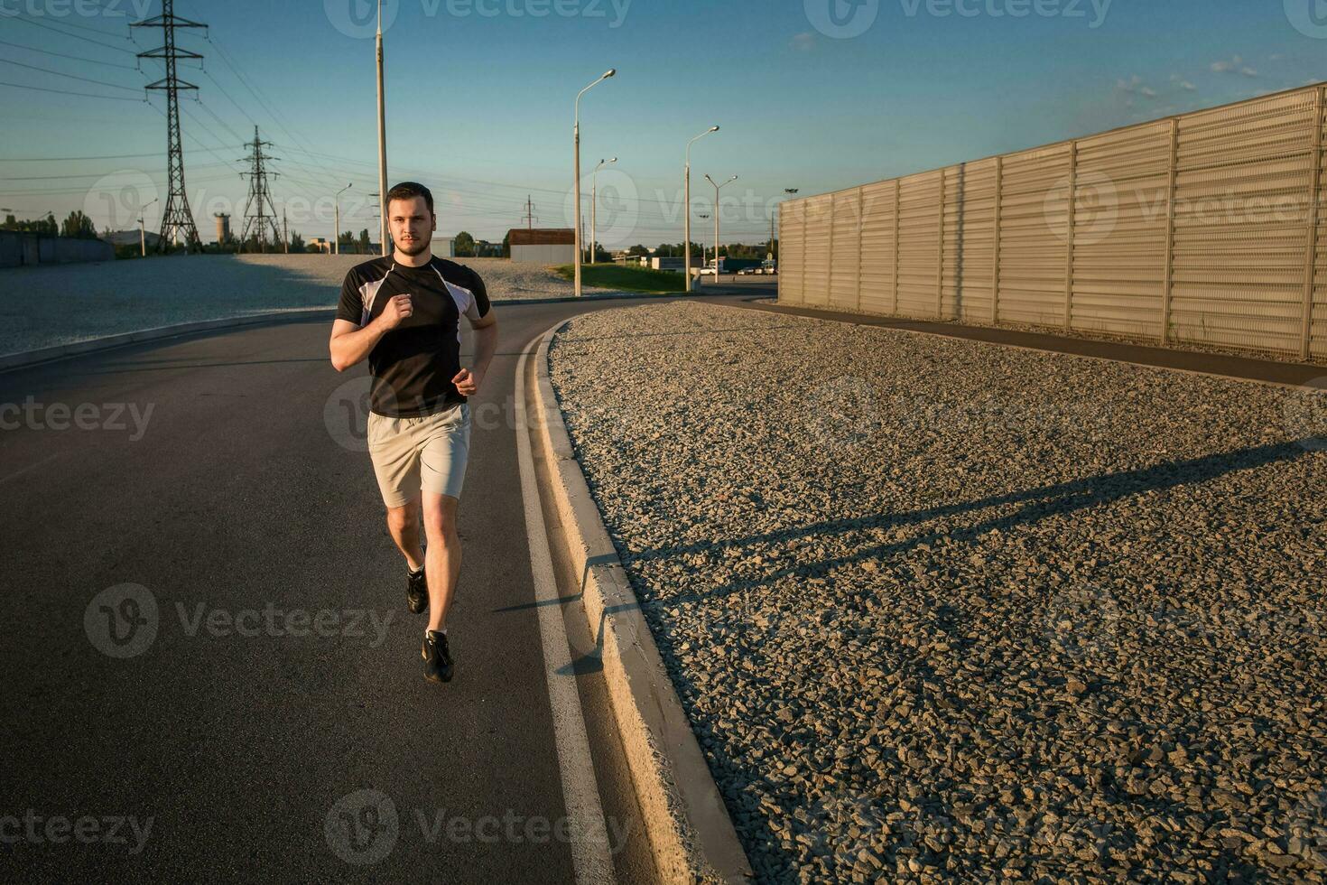 Full length portrait of athletic man running photo
