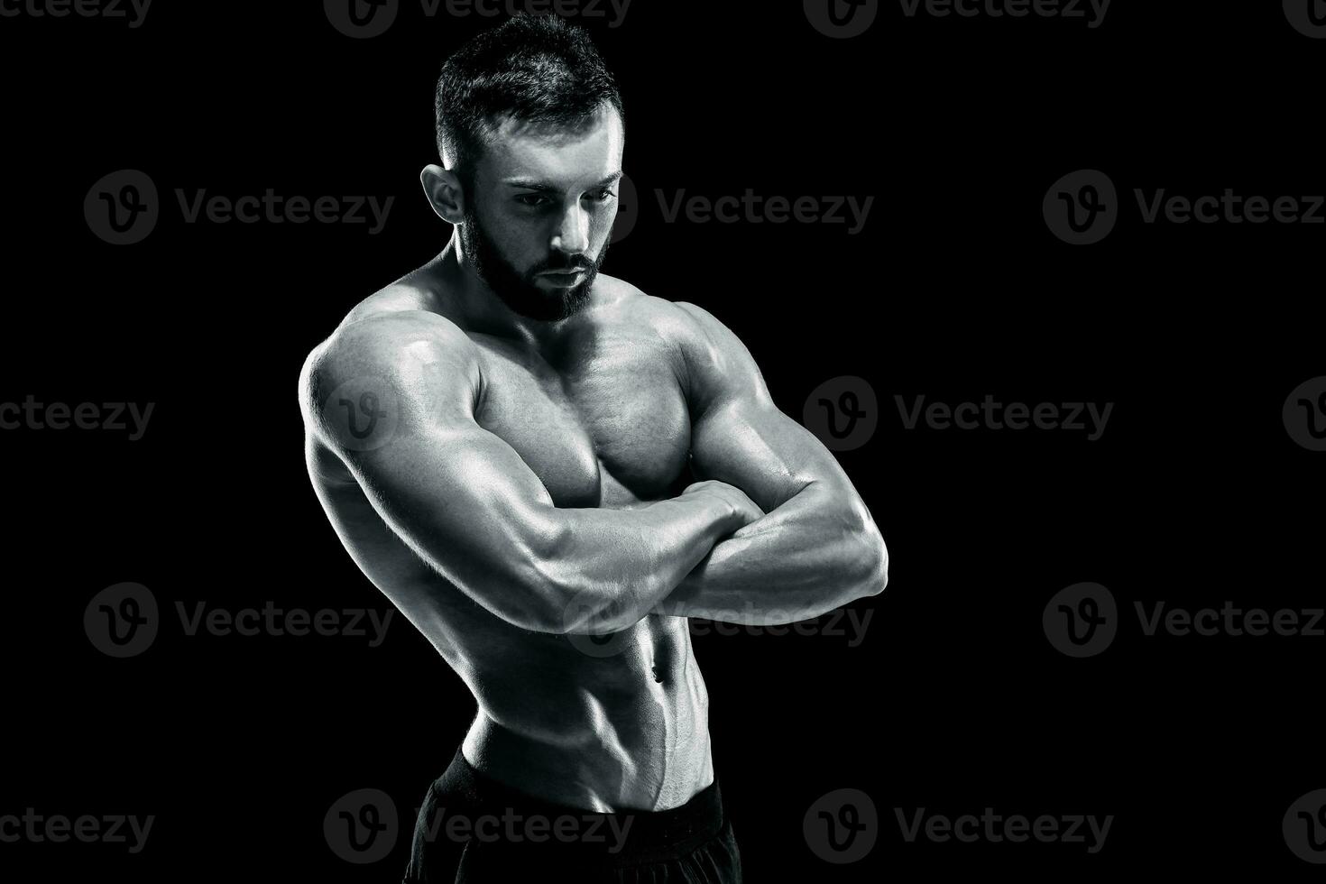 Muscular bodybuilder guy doing posing photo