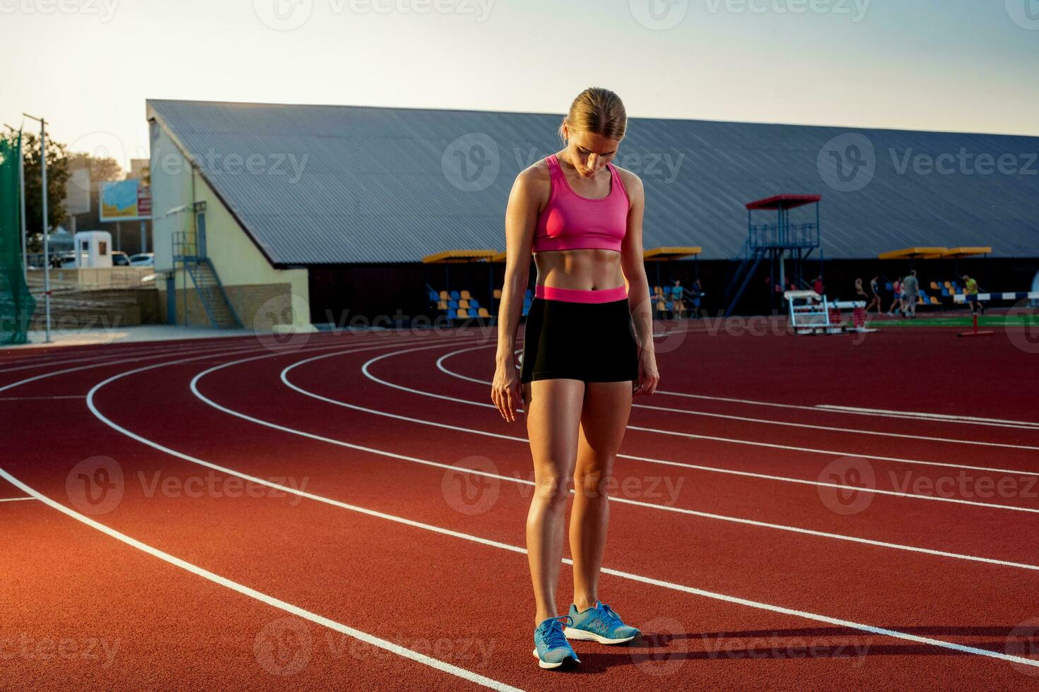 Runner sprinting towards success on run path running athletic track. Goal achievement concept. photo