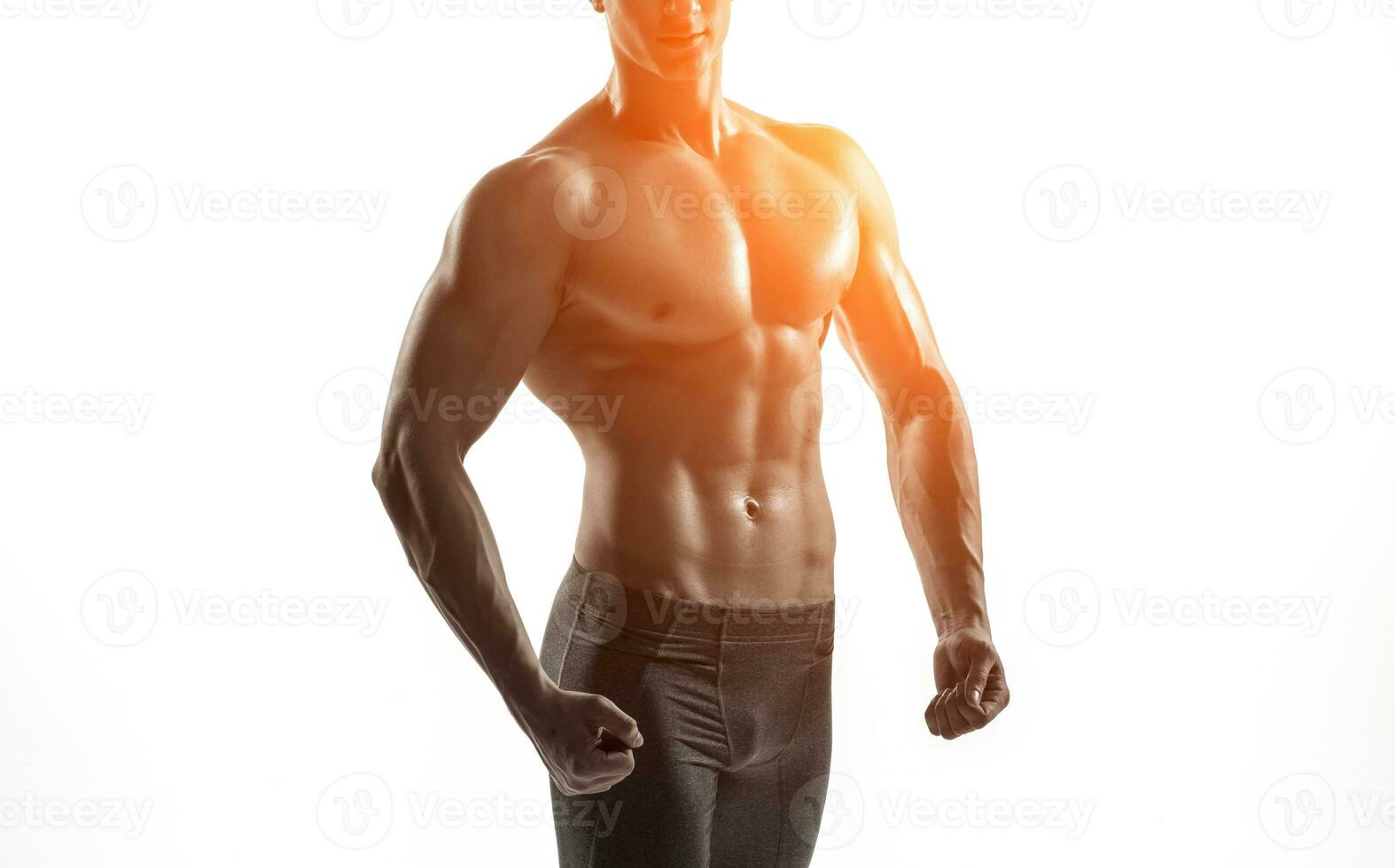 Bodybuilder man posing, showing perfect abs, houlders, biceps, triceps, chest photo