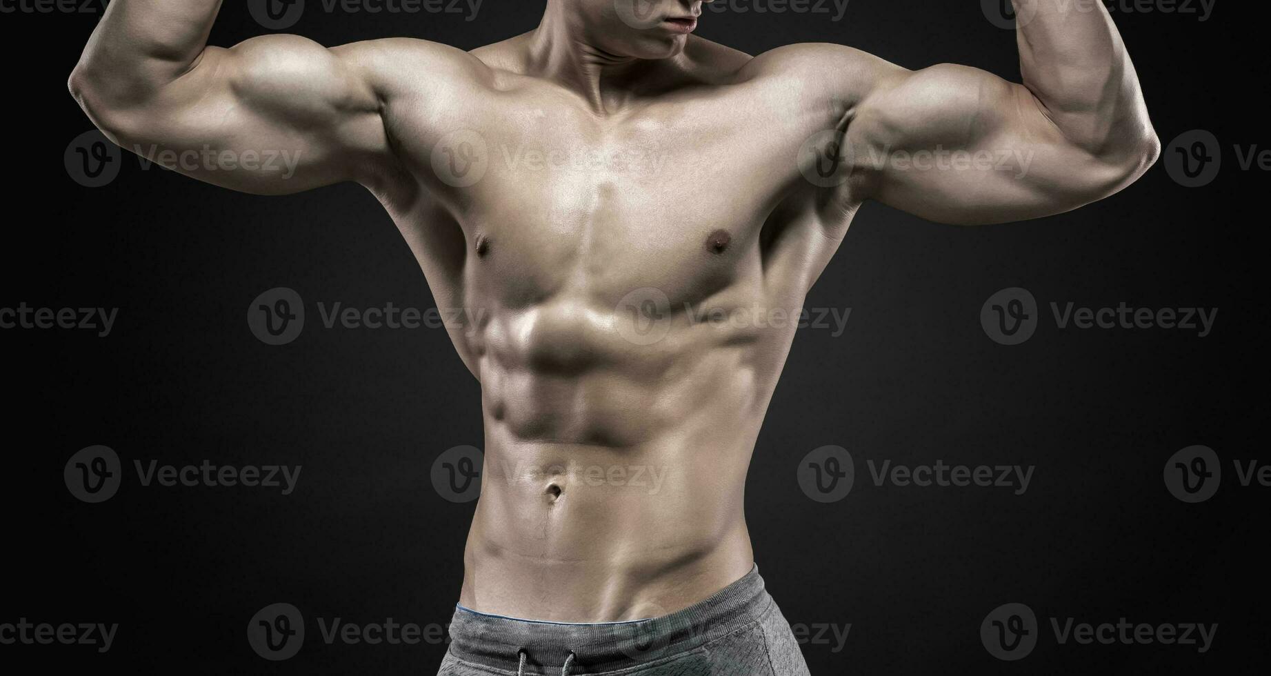 Fitness man model torso posing and showing perfect body photo