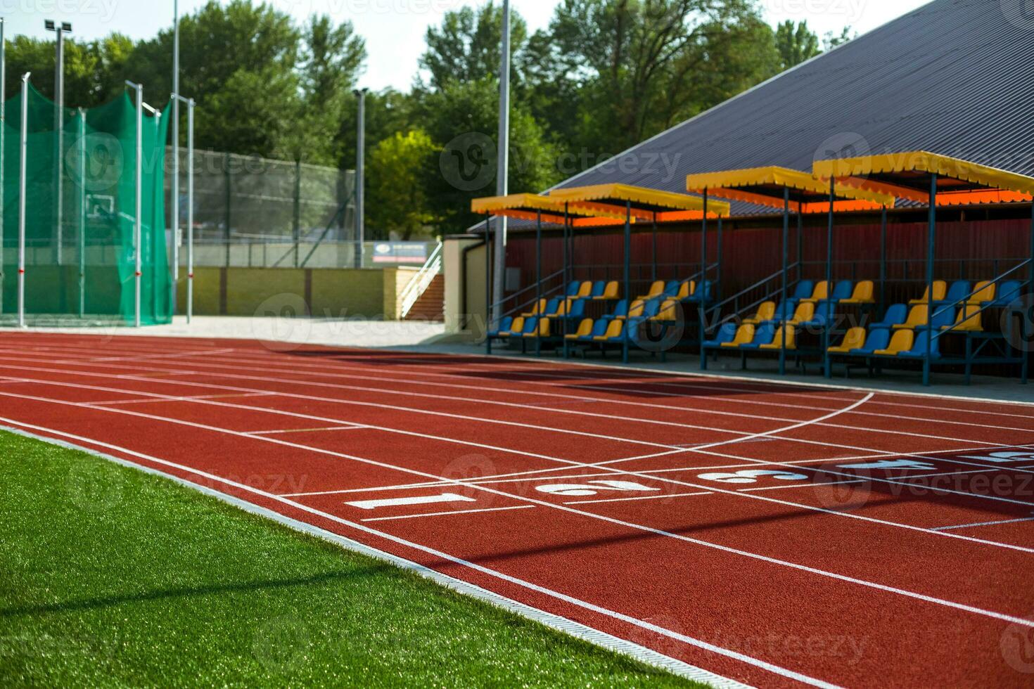 Red treadmill at the stadium with the numbering photo