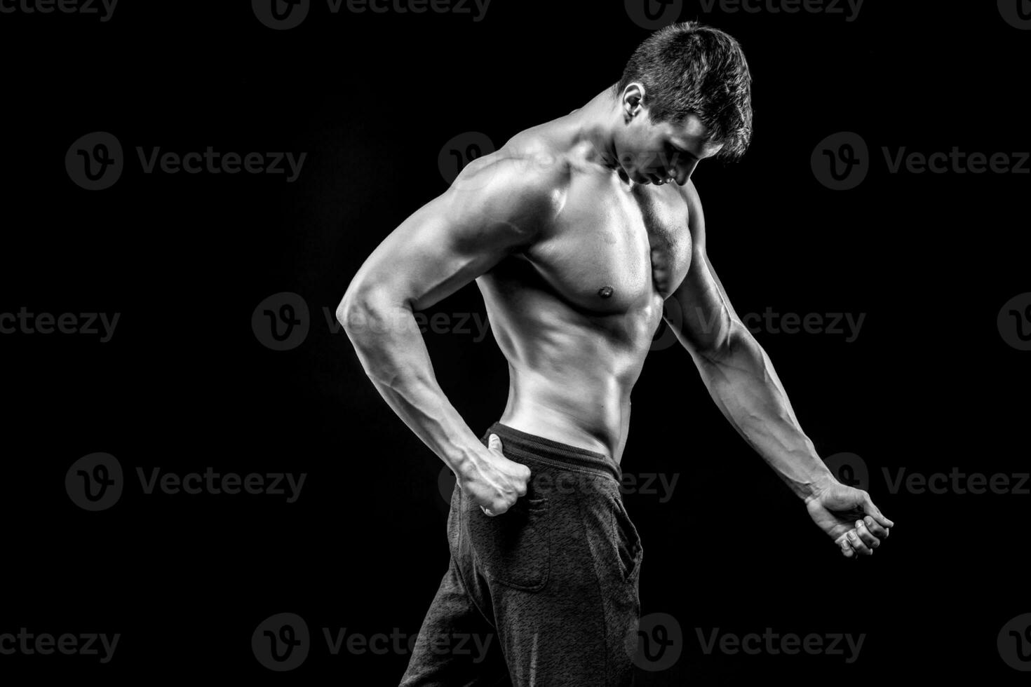 Image of very muscular man posing with naked torso photo