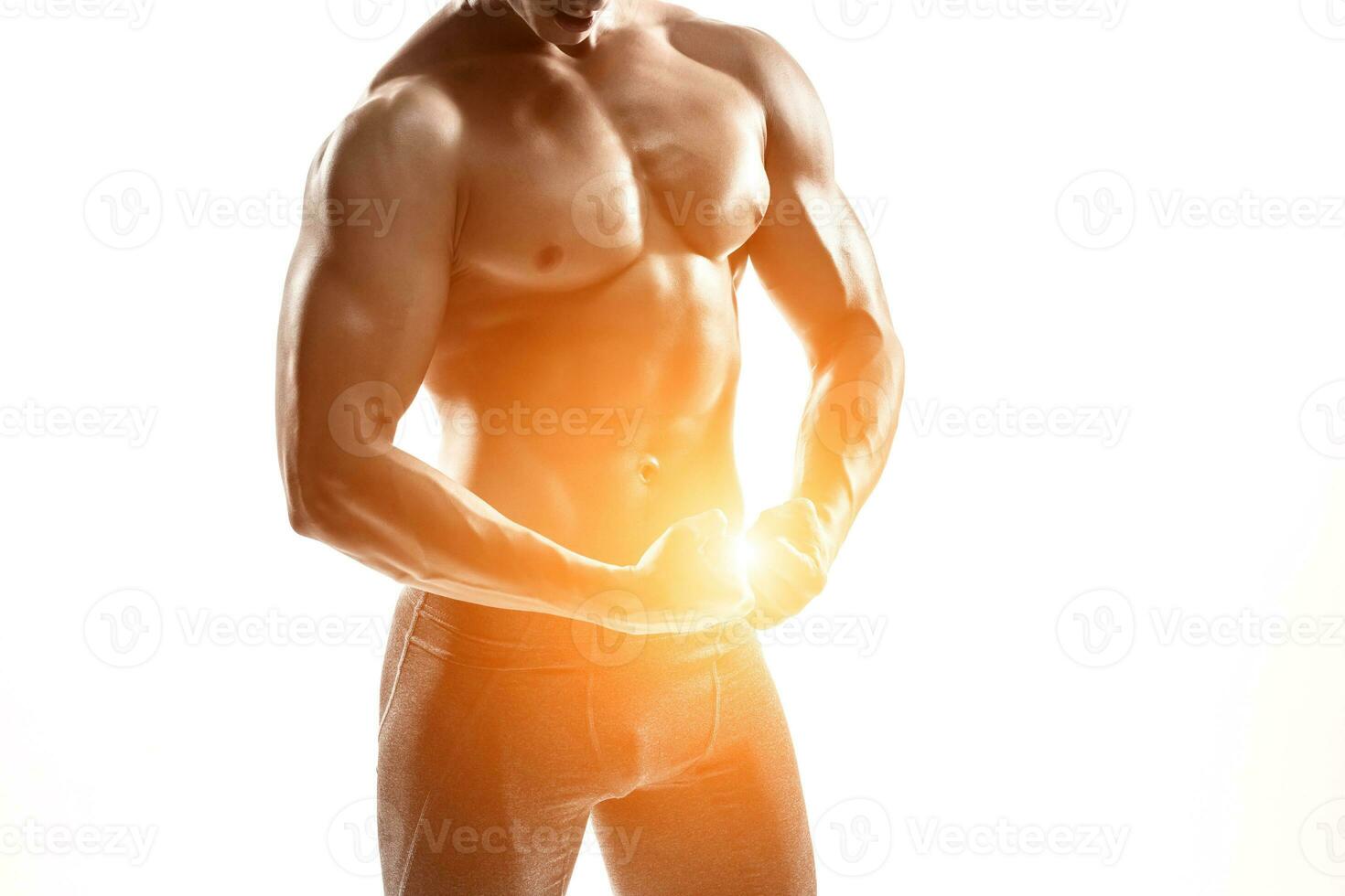 Bodybuilder man posing, showing perfect abs, houlders, biceps, triceps, chest photo