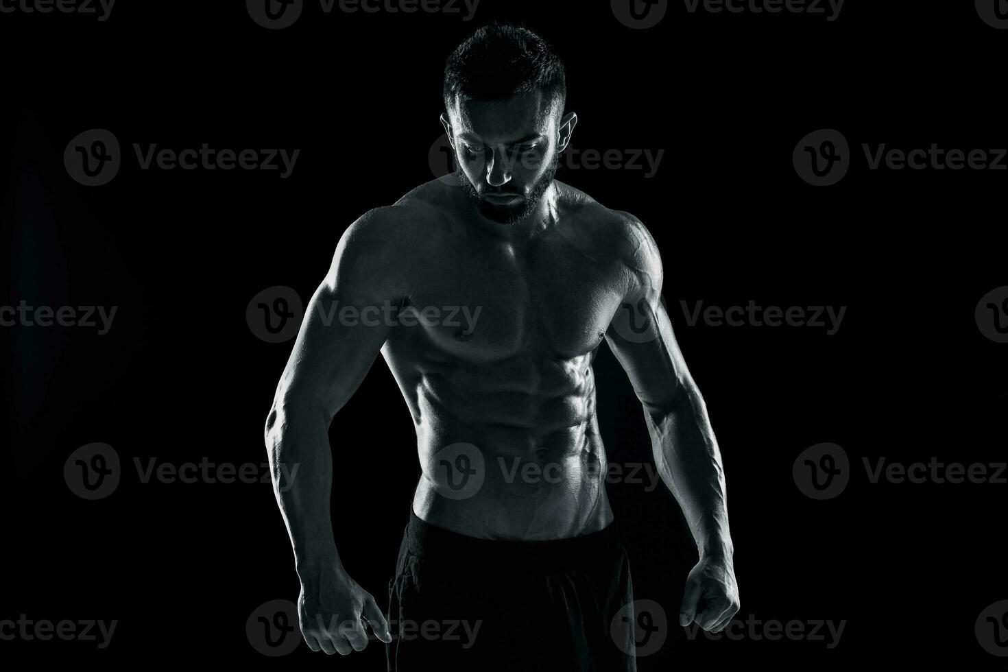 Muscular bodybuilder guy doing posing photo