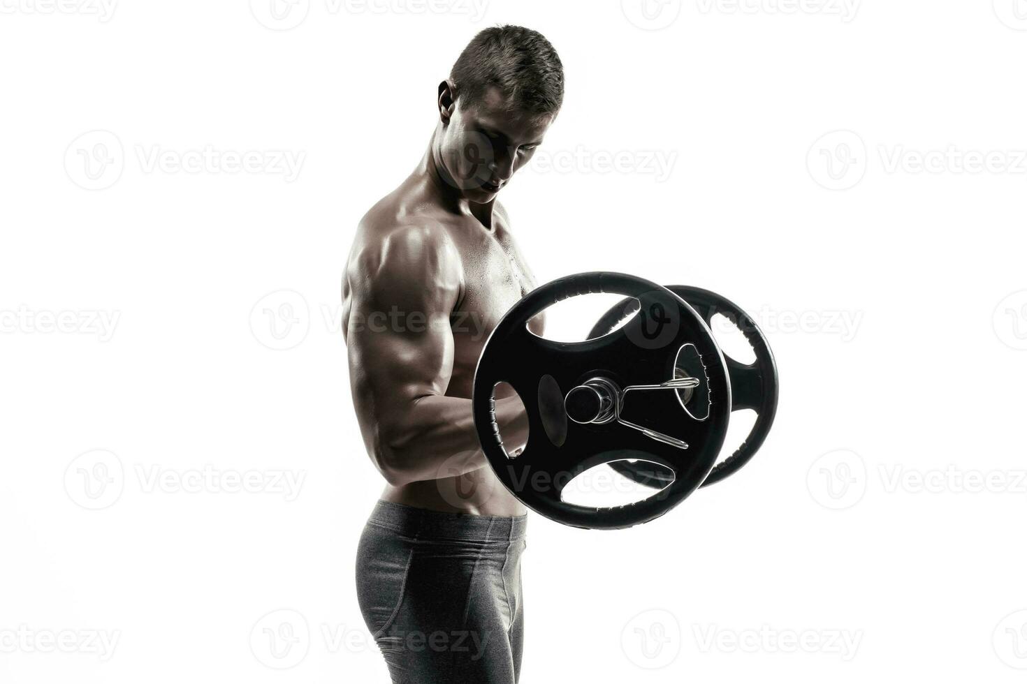 Strong man exercising fitness body building exercises with a barbell photo