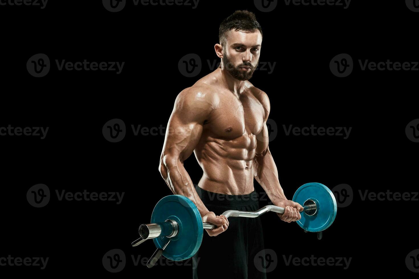 muscular man lifting weights over dark background photo