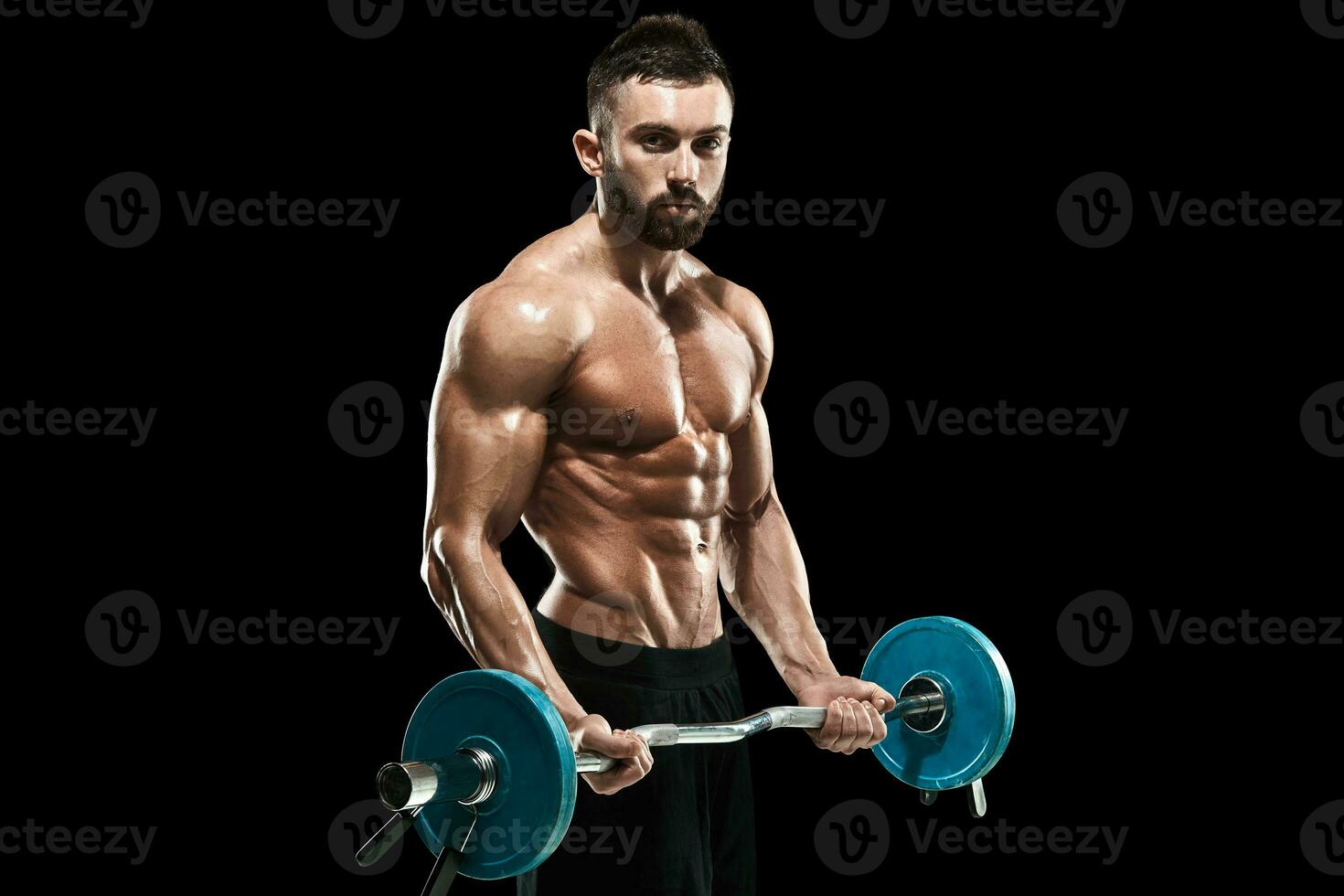 muscular man lifting weights over dark background photo