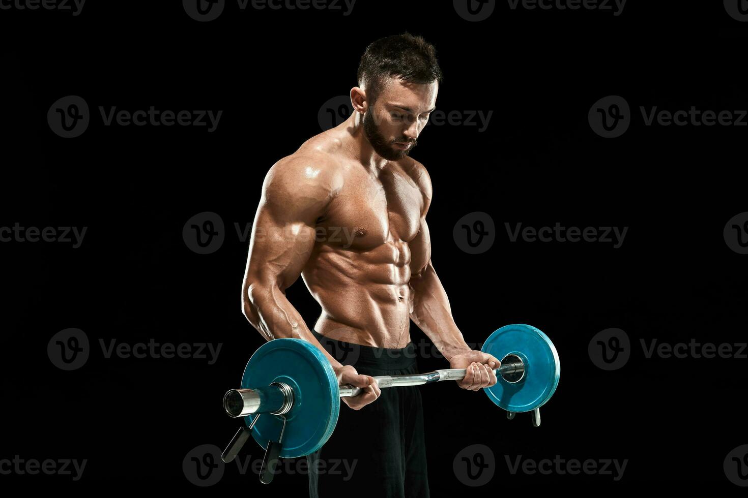 muscular man lifting weights over dark background photo