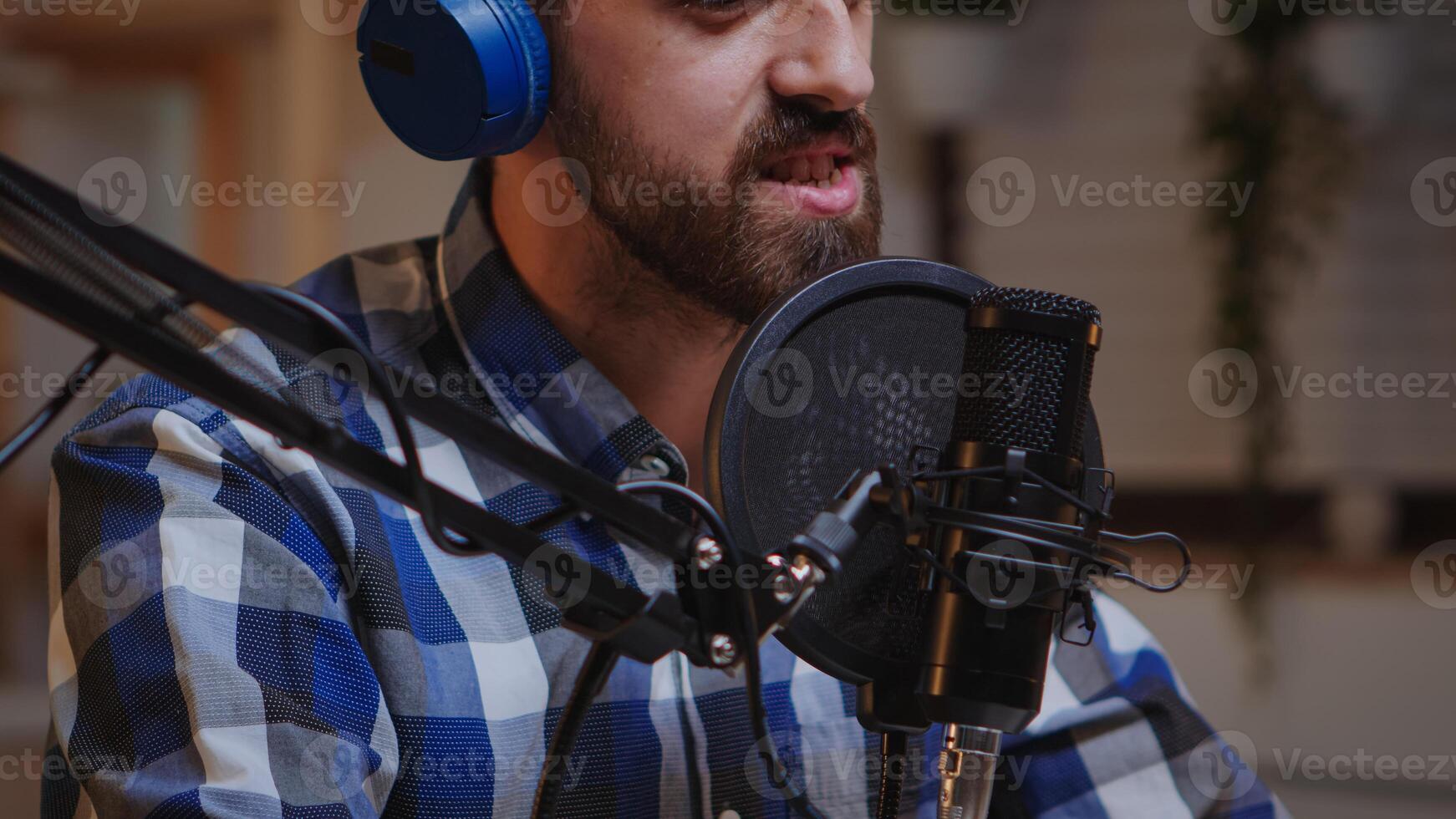 Close up of vlogger holding micophone while speaking during online interview. Creative online show Onair production internet broadcast host streaming live content, recording digital social media communication photo