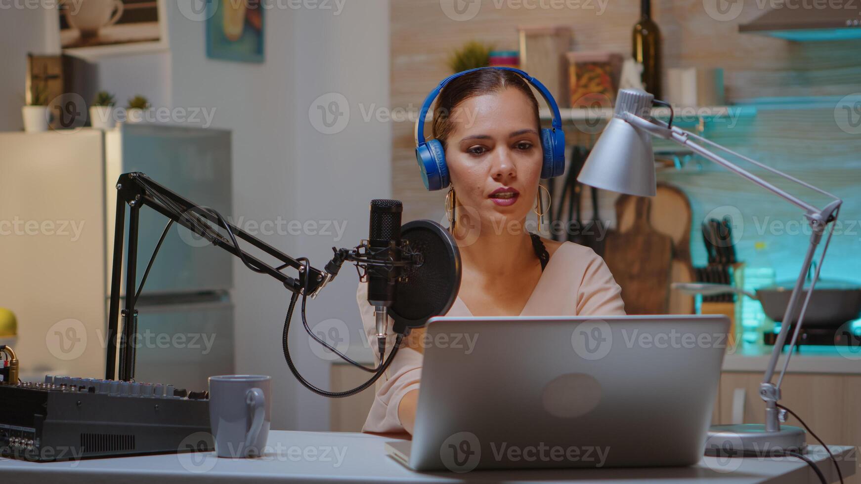 Content creator wearing headphones while recording new episode for podcast. Creative online show presenter Onair online production internet broadcast show host streaming live content, recording media photo