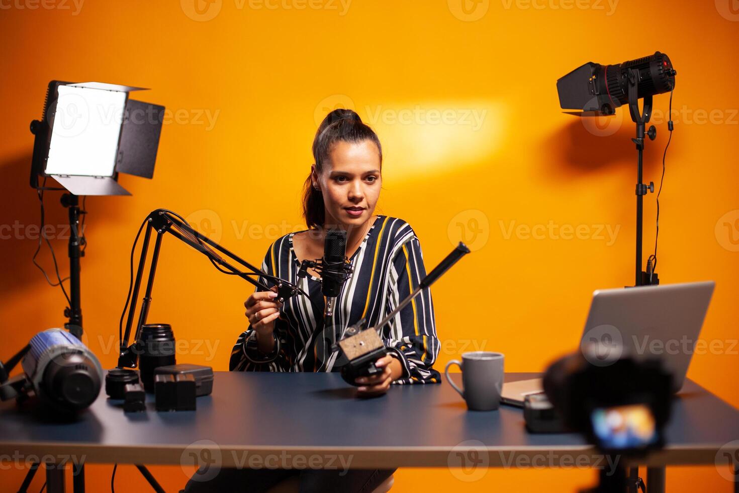 Talking about videography technology and recording videoblog. Social media star making online internet content about video equipment for web subscribers and distribution, film photo