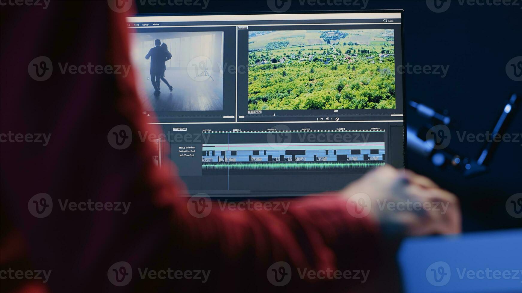 Professional video editor editing color grading and lighting in creative office, analyzing film montage, close up shot. Post production videographer manipulates raw footage, handheld camera shot photo