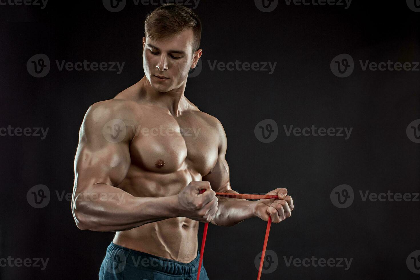 Young athletic man exercising photo