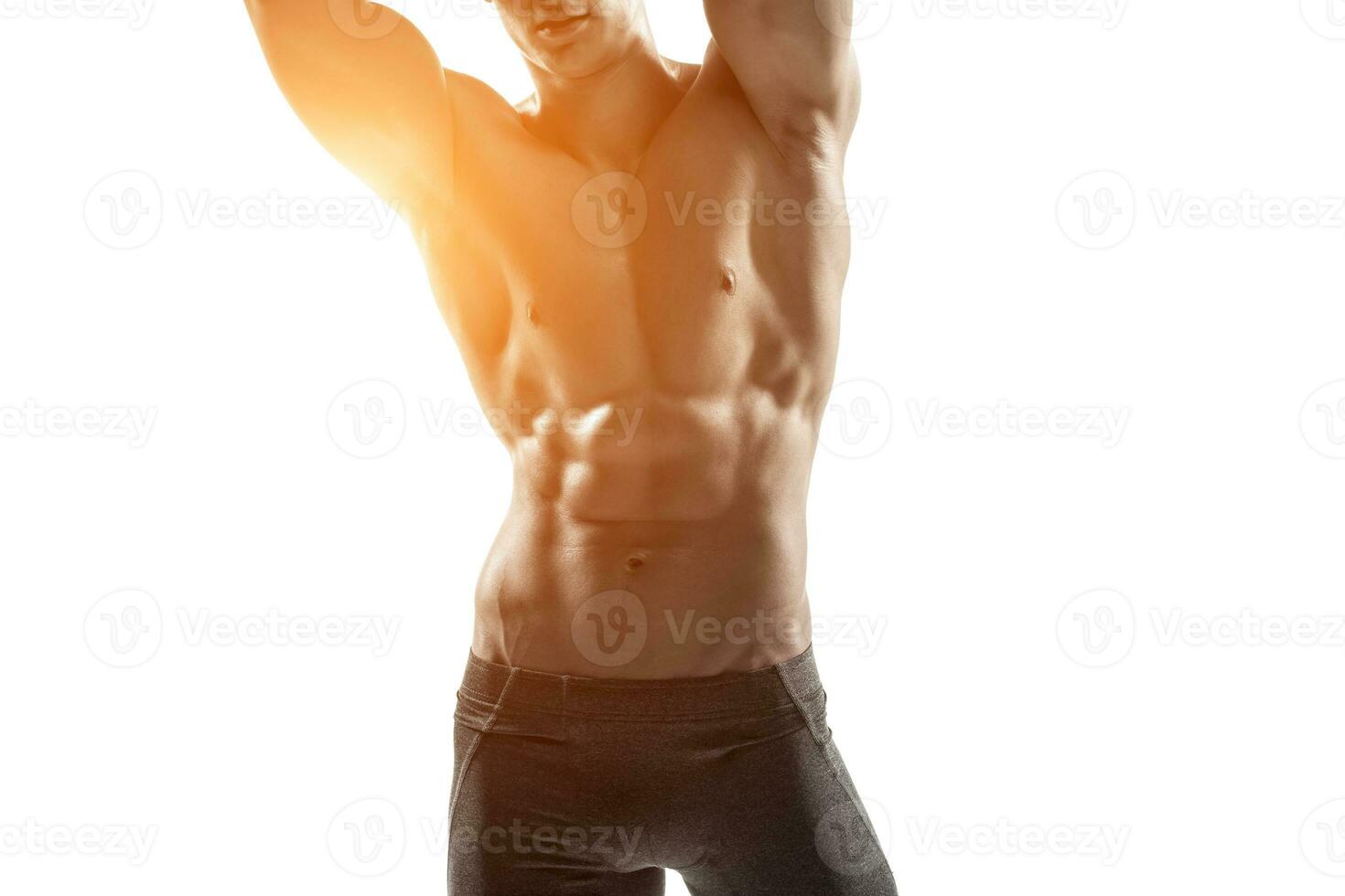 Strong man showing perfect body, abs and chest. Close-up photo
