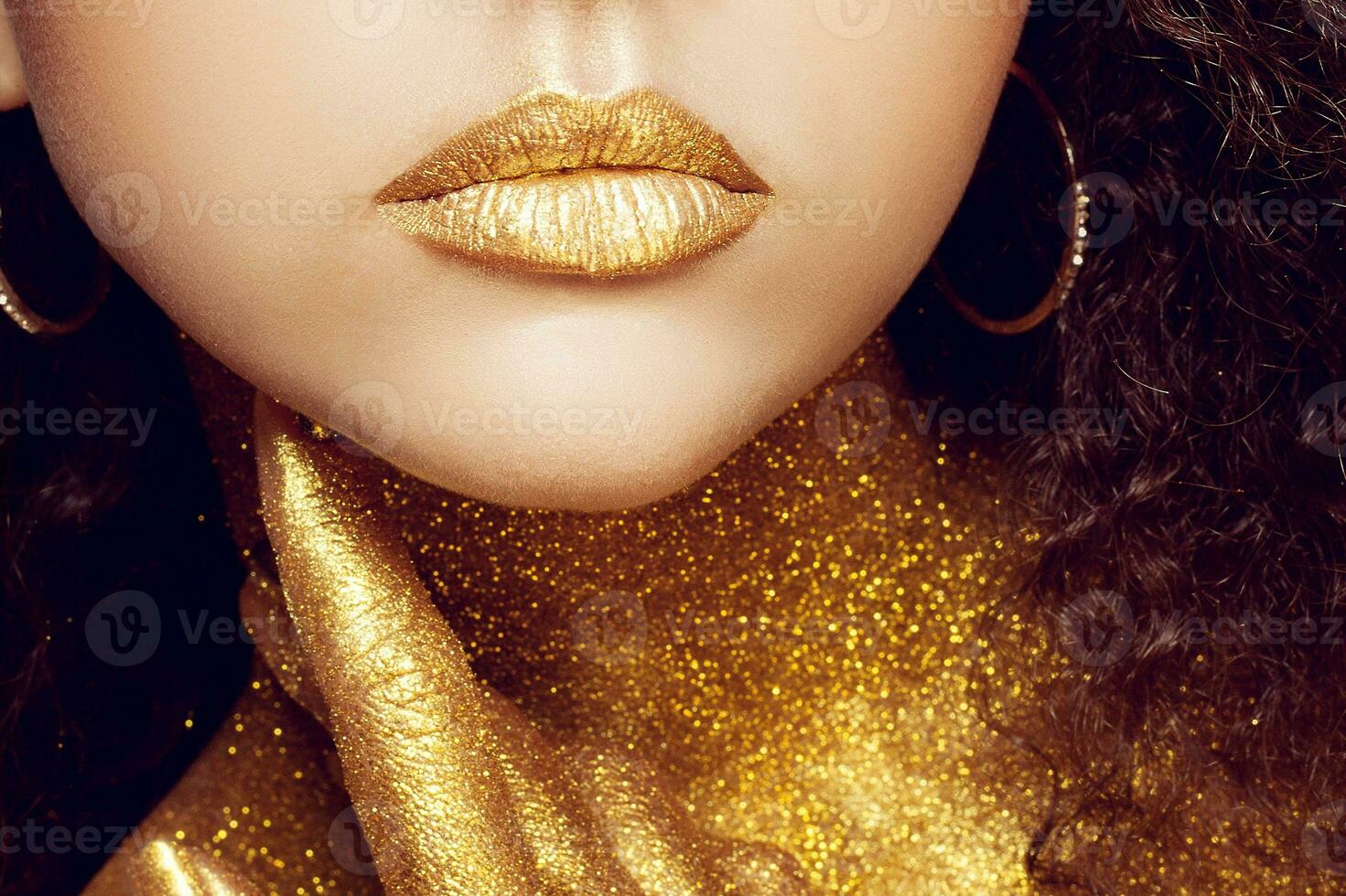 Magic Girl Portrait in Gold. Golden Makeup photo