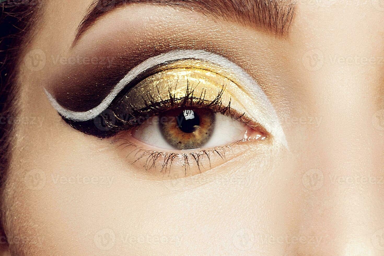 Magic Girl Portrait in Gold. Golden Makeup photo